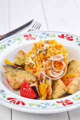 barley with roasted vegetables on the wooden background