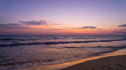 Fototapeta na wymiar Purple Sunset over mediterranean sea in Italy 