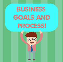 Writing note showing Business Goals And Process. Business photo showcasing Working strategies accomplish objectives Man Standing Holding Above his Head Blank Rectangular Colored Board