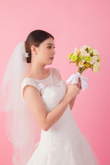 Beautiful asian bride portrait in pink studio