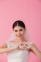 Beautiful asian bride portrait in pink studio - 270768632