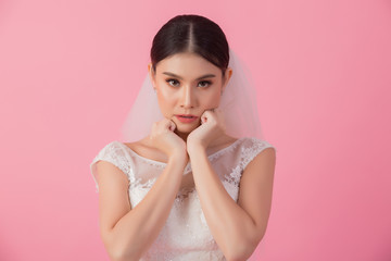Beautiful asian bride portrait in pink studio - 270768659