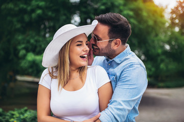 Fototapeta premium Happy young couple having fun outdoors and smiling.