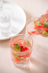 Watermelon infused water on white background