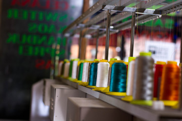 Blured embroidery machine thread in colorful inside textile industy