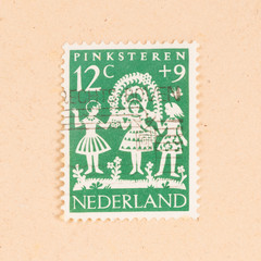 THE NETHERLANDS 1960: A stamp printed in the Netherlands shows the dutch holiday of Pinksteren,...