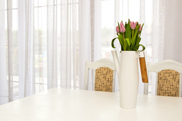 Kettle shaped flowervase on the table, home decoration