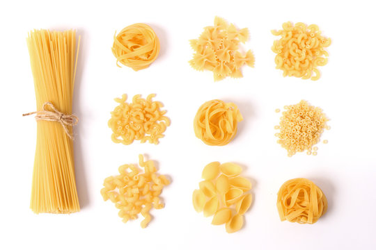 Different Types Of Pasta On A White Background Top View.