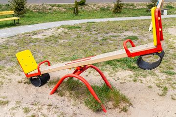 Wooden colorful seesaw board on playground. - 270773828