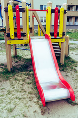 Metal colorful slide on empty playground - 270774016
