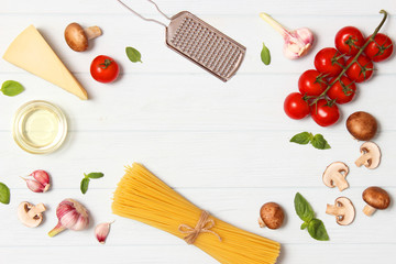 set of products for cooking Italian pasta top view, place for text