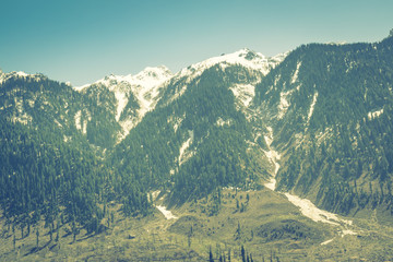 Beautiful snow covered mountains landscape Kashmir state, India .( Filtered image processed vintage effect. )