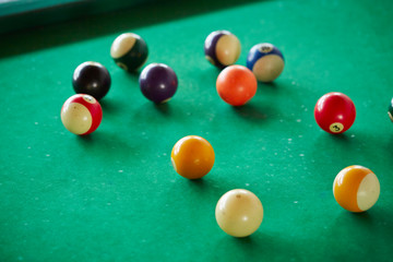 Billiards balls on green table 