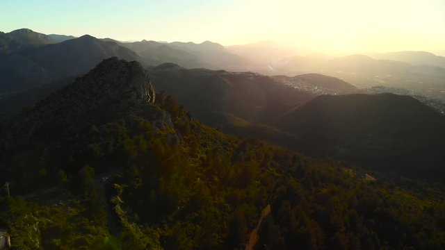 Aerial drone view of telecommunication antennas at sunset, in Segaria mountain, in Marina Alta, Alicante, Spain