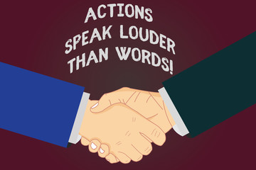 Writing note showing Actions Speak Louder Than Words. Business photo showcasing Make execute accomplish more talk less Hu analysis Shaking Hands on Agreement Sign of Respect and Honor