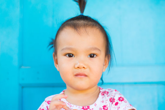 Asian girl's face photos on a fresh blue background