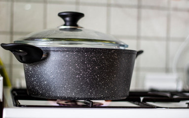 Broccoli boiling in the pot in the house.