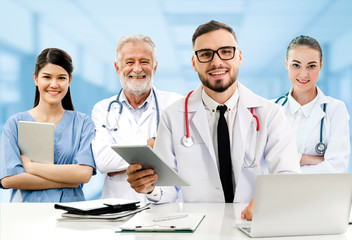 Healthcare people group. Professional doctor working in hospital office or clinic with other...