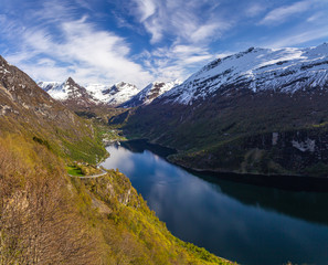 Naklejka na ściany i meble Famous Geiranger fiord in Norway. Spring time beautiful weather and colours.