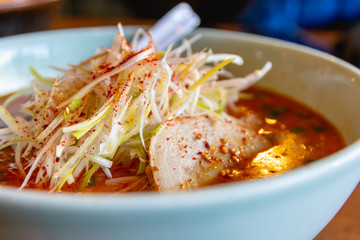 Spicy Japanese ramen noodle soup with egg, Japanese food culture, close up image.