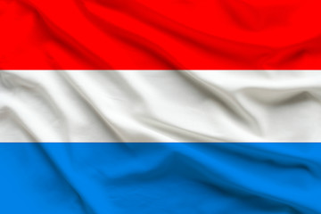 silk national flag of Luxemburg with folds