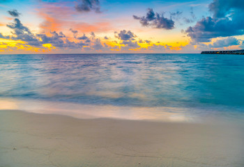 Fototapeta na wymiar Beautiful water villas in tropical Maldives island at the sunset time .