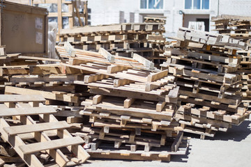 many wooden construction pallets