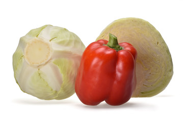 Two cabbages and bright red pepper on a neutral white background