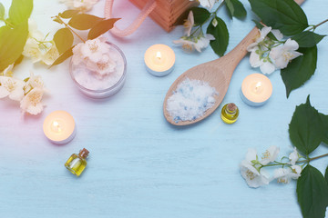 Aromatic oils, sea salt, candles and jasmine flowers. Spa ingredients for massage and relaxation.