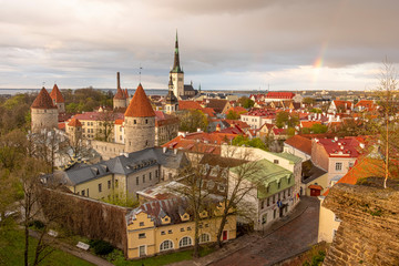 Fototapeta premium Panorama of the city center of Tallinn, with a rainbow in the sky on a spring evening after a thunderstorm and rain