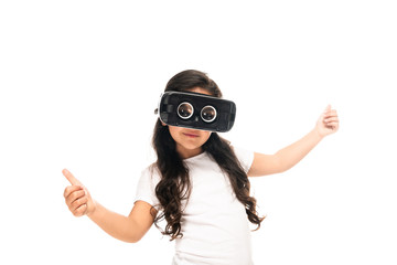 Obraz na płótnie Canvas latin kid showing thumbs up while wearing virtual reality headset isolated on white