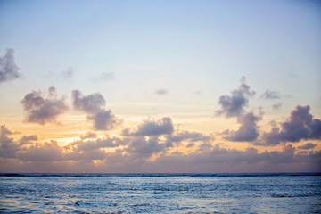 Happy beautiful fashion family, children, casually dressed, enjoying the sunrise on the beach