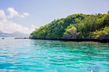 Obraz premium Beautiful amazing nature background. Tropical blue sun sea. Luxury holiday resort. Island atoll about coral reef. Fresh freedom. Adventure day