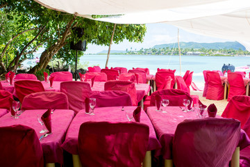 Tables, set for lunch at the beach