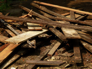 pile of old wood plank in construction site