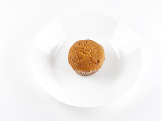 banana cake is on the plate on white background. Top view