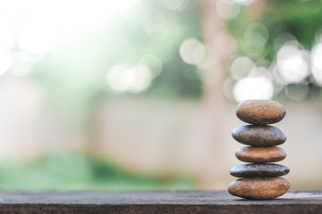 Balance stone with spa on abstract bokeh nature background