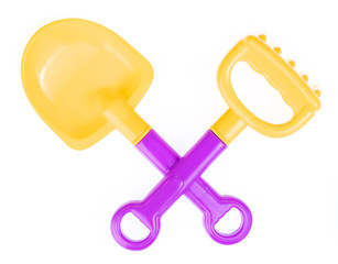 beach toy of plastic tool shovel and rake isolated on white background