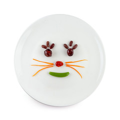 Vegetable salad that is a cartoon face