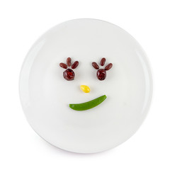 Vegetable salad that is a cartoon face