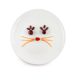 Vegetable salad that is a cartoon face