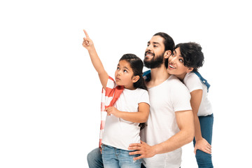 Obraz premium cute latin kid pointing with finger enar happy parents isolated on white