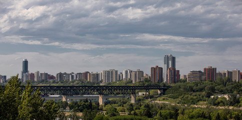 Obraz premium Edmonton, Alberta, Canada -Bridges and Several Skyscrapers of Edmonton downtown at sunset on a cloudy day