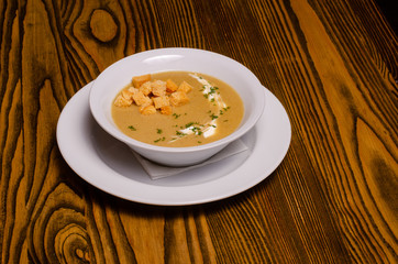 Minestrone, italian vegetable soup with pasta on wooden table. Top view