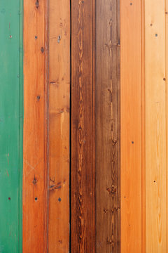 Colored wooden board with screws texture background