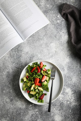 Salad with baby spinach. avocado and strawberries. Top view.