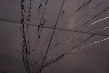 long cracks on broken glass close up. texture, background, wallpaper