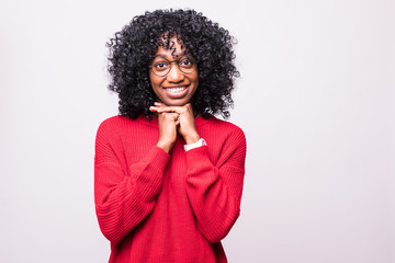 Portrait of beautiful casually dressed african young woman in round glasses having doubtful...
