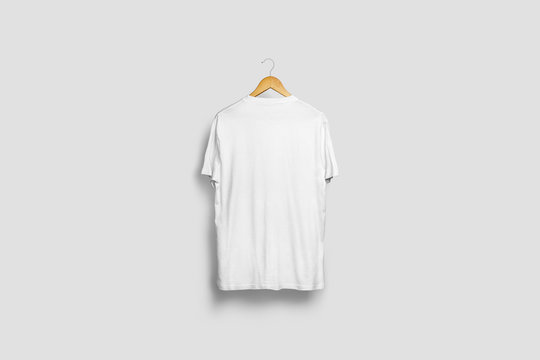 Blank soft gray T-Shirt Mock-up hanging on white wall, back side view. Ready to replace your design.3D rendering