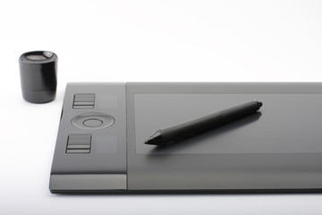 graphic tablet and pen and stand for nibs on white background